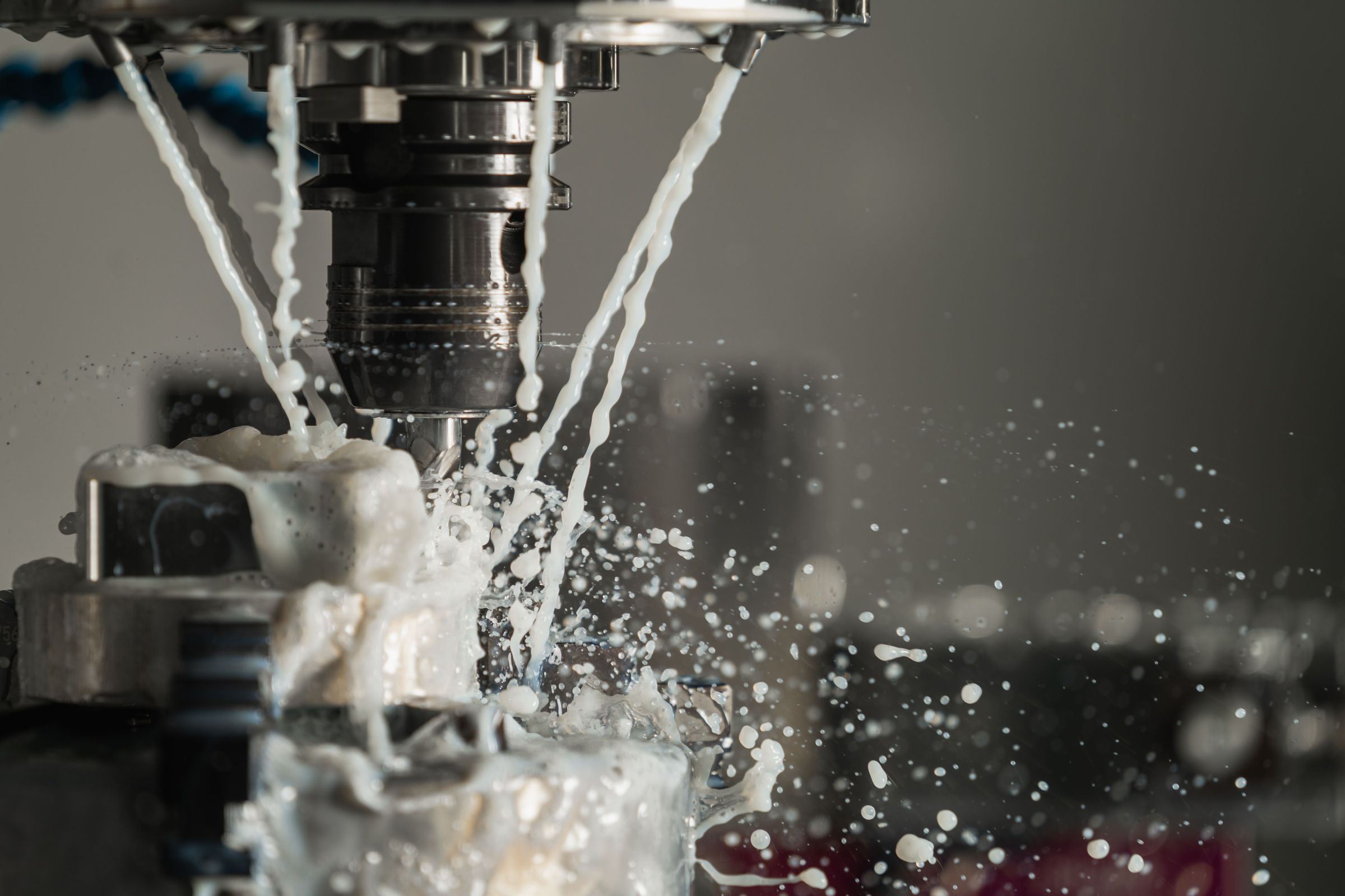 CNC machining with coolant spray