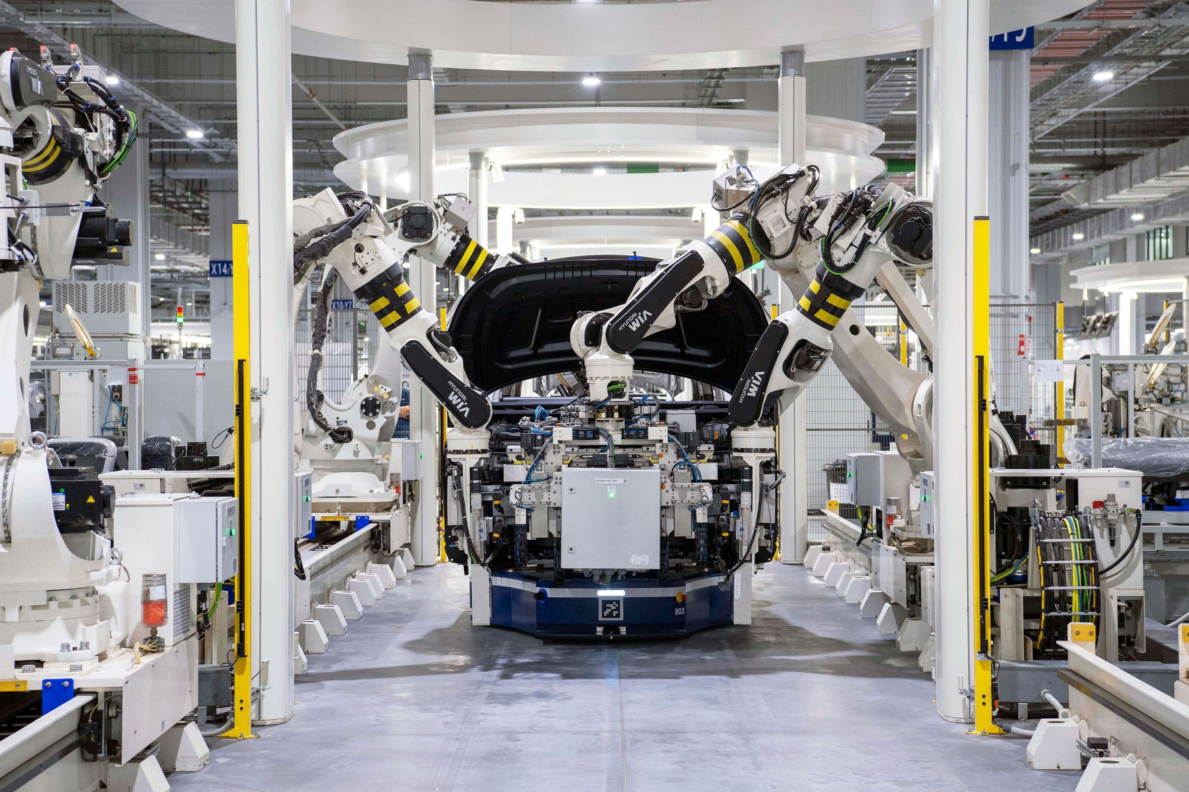 Robotic assembly line in an automotive plant